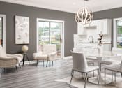 Thumbnail 13 of 22 - Modern dining area with white table and chairs at Southwind Apartments in Richland, MS.