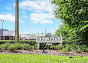 Thumbnail 16 of 22 - Southwind Apartments entrance sign in a landscaped garden in Richland, MS.