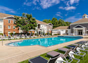 Thumbnail 5 of 38 - Community pool with seating at The Foundry Carrollton GA