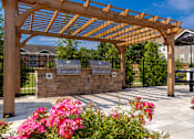 Thumbnail 6 of 38 - Pergola walkway with landscaping at The Foundry Carrollton GA