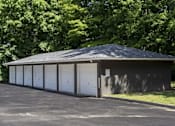 Thumbnail 28 of 34 - a small garage with white doors