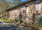Thumbnail 6 of 37 - A brick building with a sign that says B on it.