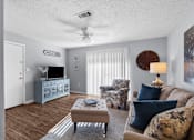 Thumbnail 10 of 25 - Inviting Living Room at Lakeland East Apartments – Flowood, MS