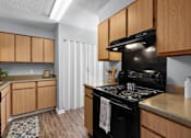 Thumbnail 5 of 25 - A kitchen with a black stove top oven and wooden cabinets.