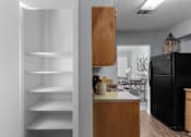 Thumbnail 8 of 25 - Functional Kitchen with Black Appliances at Lakeland East Apartments – Flowood, MS