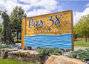 Thumbnail 17 of 20 - a sign for the pnr 33 apartments on the side of a road