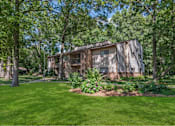 Thumbnail 22 of 30 - a house in the middle of a yard with trees