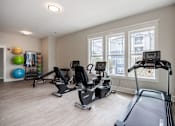 Thumbnail 17 of 26 - gym with exercise equipment at Sunday Village Apartments, Austin
