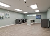 Thumbnail 7 of 16 - Laundry Room for resident use at Sweetwater Point in Douglasville, GA