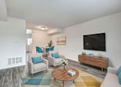 Thumbnail 2 of 12 - Living Room with TV at Lawndale Farms, Virginia, 23150