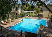 Thumbnail 14 of 22 - swimming pool view from an upstairs patio at Abby Creek Apartments, Carmichael, CA 