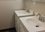 Thumbnail 19 of 20 - Bathroom with two sinks and a mirror
