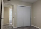 Thumbnail 15 of 20 - Bedroom with two white closet doors