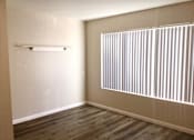 Thumbnail 17 of 20 - Bedroom room with a large window and wood floors