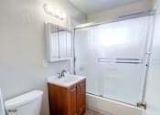 Thumbnail 20 of 34 - Monterey Manor vacant apartment  bathroom with a tub/shower, sink, and toilet