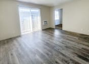 Thumbnail 26 of 34 - Monterey Manor Vacant Apartment living room and patio door and vinyl plank floor