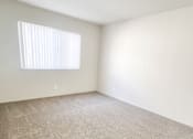 Thumbnail 22 of 34 - Monterey Manor vacant apartment bedroom with carpet , window and blinds