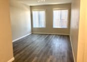 Thumbnail 18 of 20 - Living room with wooden floors and two windows