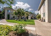 Thumbnail 3 of 34 - Courtyard with Sidewalks at Monterey Manor Apartments, San Jose, 95111