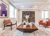 Thumbnail 8 of 57 - a living room with couches and a coffee table