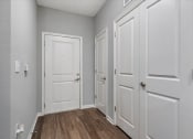 Thumbnail 42 of 42 - an empty room with white doors and wood floors