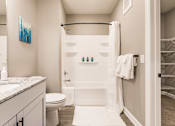 Thumbnail 93 of 94 - a bathroom with a shower and a toilet and a sink