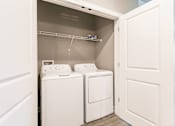 Thumbnail 77 of 94 - a washer and dryer in a laundry room with white doors