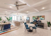 Thumbnail 12 of 57 - a dining room and kitchen with a table and chairs at Swiftwater apartments in Port Charlotte, FL