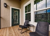 Thumbnail 82 of 94 - a balcony with chairs and a table