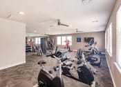 Thumbnail 16 of 57 - fitness center with cardio equipment at Swiftwater apartments in Port Charlotte, FL