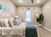 Thumbnail 48 of 94 - an empty bedroom with a bed and a window