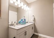 Thumbnail 72 of 94 - a bathroom with a sink and a mirror