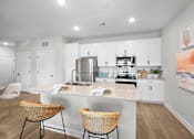 Thumbnail 4 of 83 - A kitchen with a white countertop and a sink.