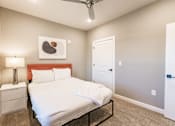 Thumbnail 90 of 94 - a bedroom with a white bed and a closet