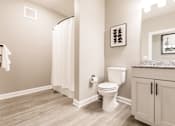 Thumbnail 52 of 94 - a bathroom with a toilet and a shower and a sink