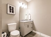 Thumbnail 53 of 94 - a bathroom with a toilet and a sink at Vantage Luxury Apartments in  Cape Coral, FL