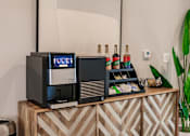 Thumbnail 26 of 94 - a coffee machine on a counter at Vantage Luxury Apartments in  Cape Coral, FL