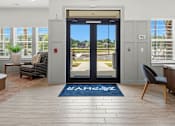 Thumbnail 36 of 51 - A modern interior with a view of the outdoors through a glass door.