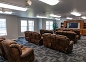 Thumbnail 26 of 41 - a picture of brown chairs and a tv