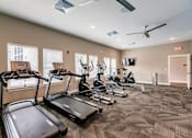 Thumbnail 30 of 94 - a row of treadmills at Vantage Luxury Apartments in  Cape Coral, FL