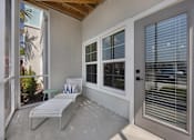Thumbnail 13 of 83 - A patio with a white chair and table.