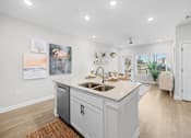 Thumbnail 2 of 83 - A kitchen with a white countertop and a sink.