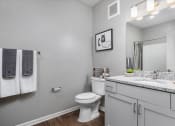 Thumbnail 38 of 42 - a bathroom with a toilet and a sink