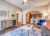 Thumbnail 30 of 34 - A living room with couch, table, and cabinets at the Flats at Sundown in North Port, Florida