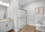 Thumbnail 33 of 83 - A white bathroom with a toilet, sink, and shower.