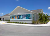 Thumbnail 76 of 83 - A building with a mural of cartoon characters on the side.