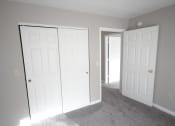 Thumbnail 11 of 18 - Bedroom with two closets and a doorway at Conner Court apartments in Connersville, IN