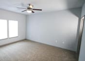 Thumbnail 27 of 31 - Bedroom with a ceiling fan and two windows at Mosaic Apartments in Avon, Indiana