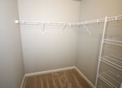 Thumbnail 13 of 25 - Empty white shelves in a room.