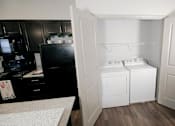 Thumbnail 21 of 31 - a white washer and dryer in a room at Mosaic Apartments in Avon, Indiana